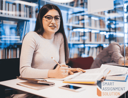 Student studying in library - Assignment Help UK